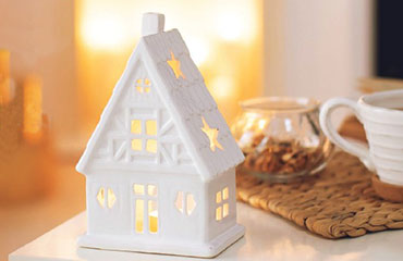 Christmas themed image of a ceramic house